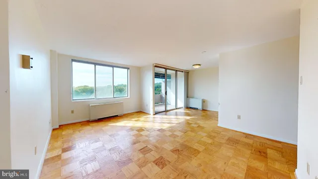 a view of an empty room with a window