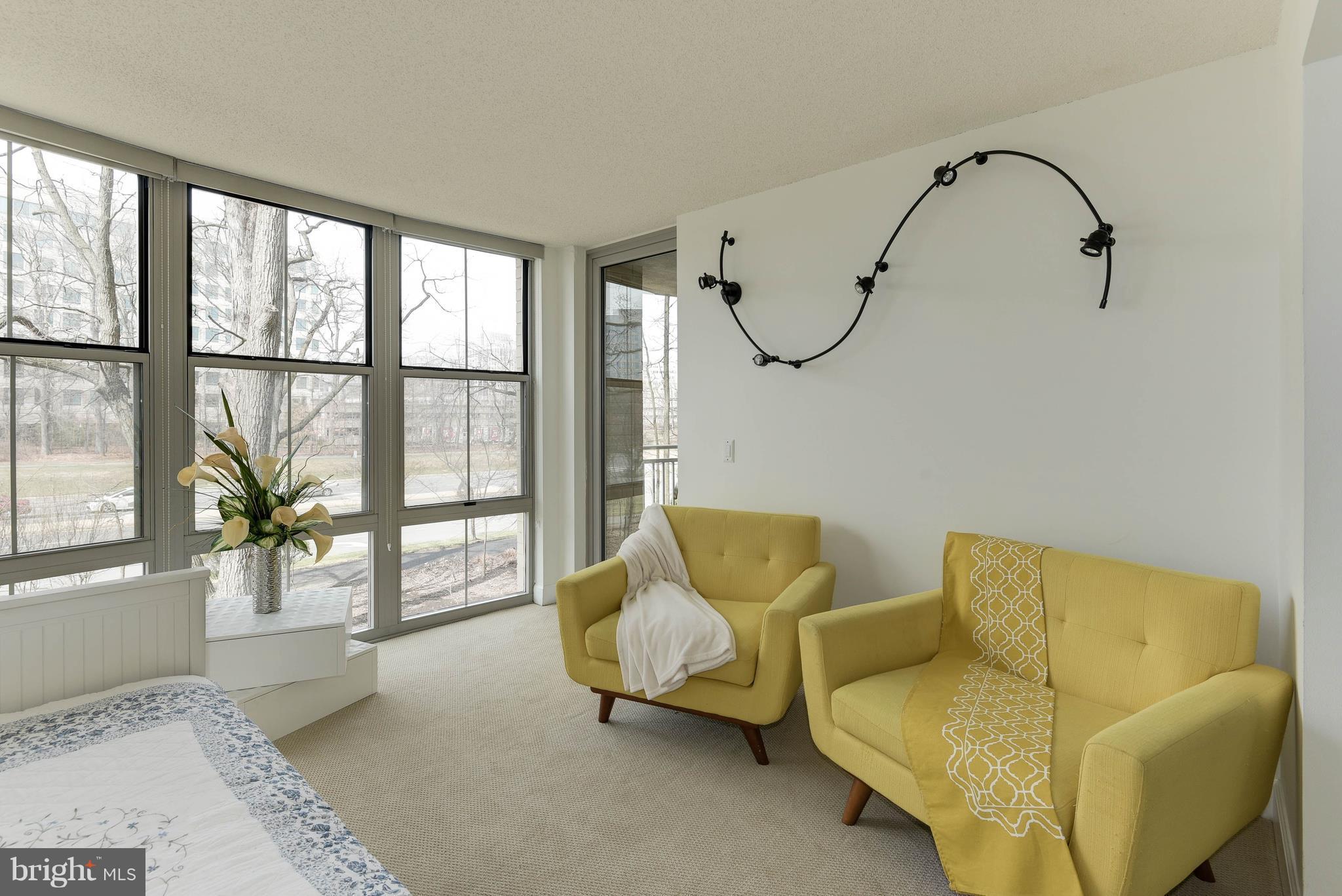 11800 Sunset Hills Road, Unit 314 Reston, VA 20190 - Photo 15 of 30 a living room with furniture and a window