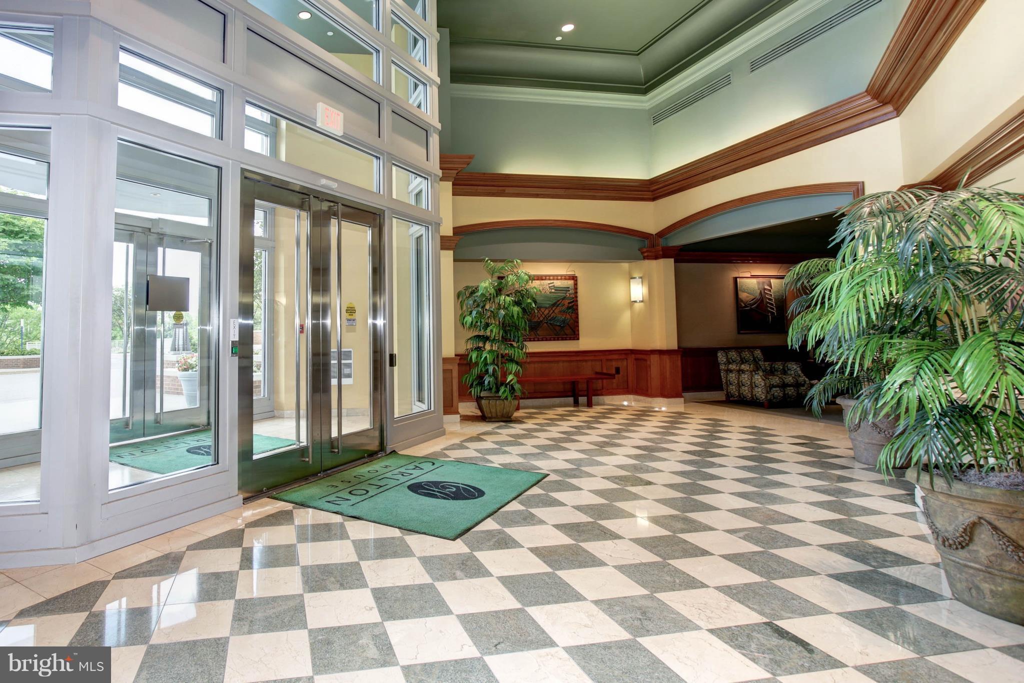 11800 Sunset Hills Road, Unit 314 Reston, VA 20190 - Photo 22 of 30 a room with lots of windows and plants