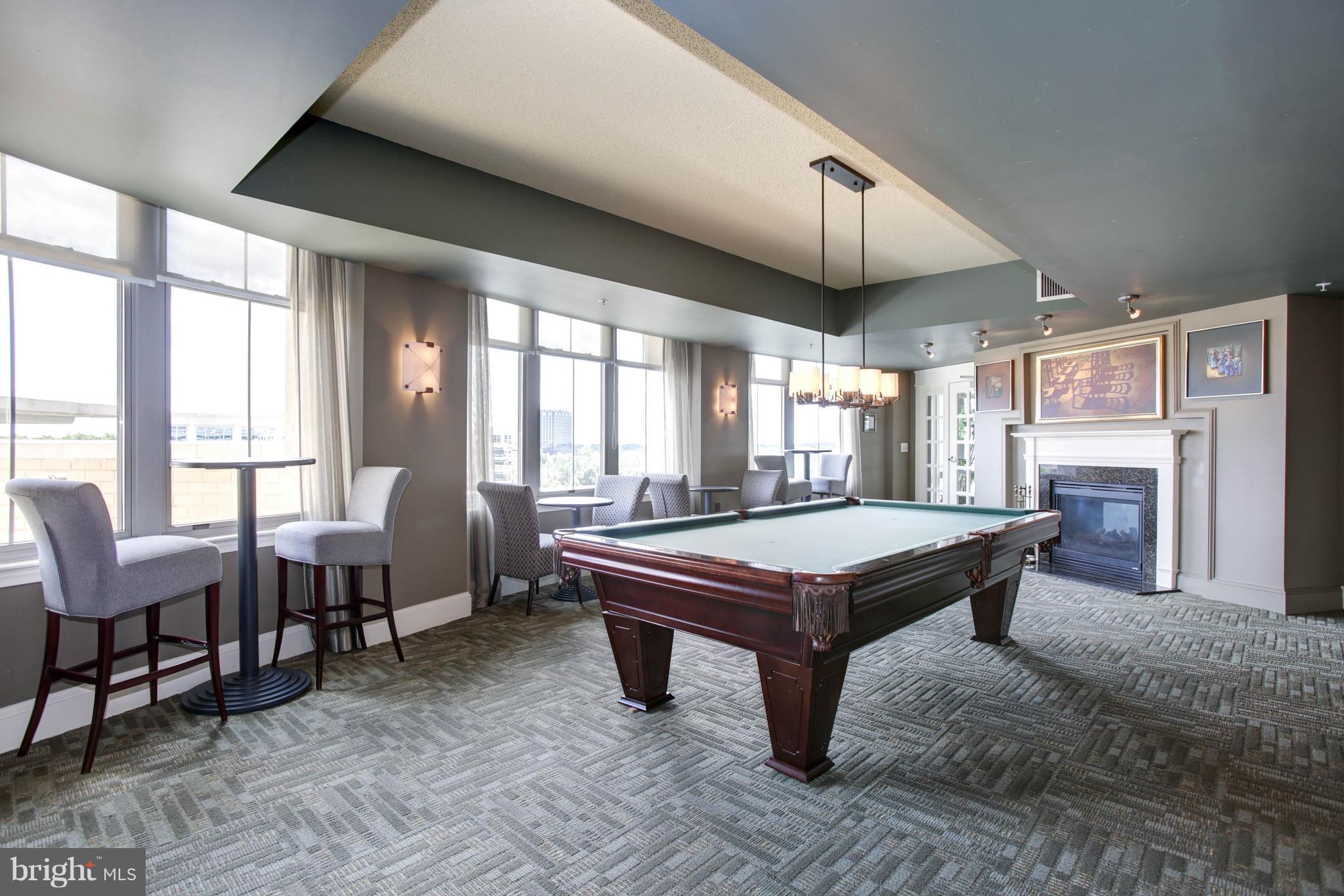11800 Sunset Hills Road, Unit 314 Reston, VA 20190 - Photo 25 of 30 a room with pool table and windows
