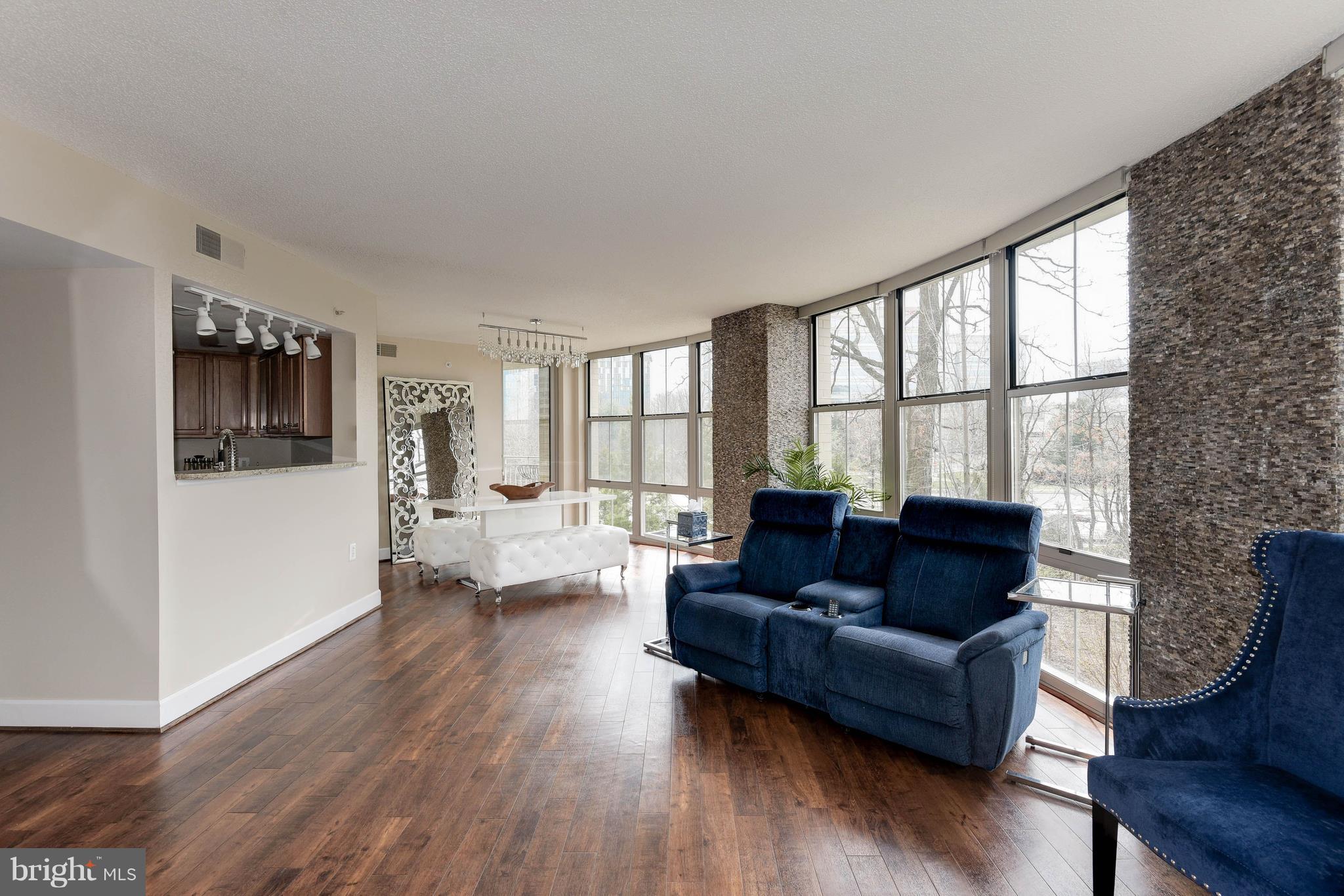 11800 Sunset Hills Road, Unit 314 Reston, VA 20190 - Photo 30 of 53 a living room with furniture and a large window