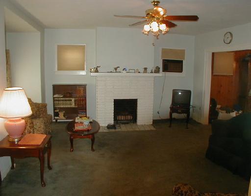 1436 Ridge Avenue Coraopolis, PA 15108 - Photo 2 of 8 Living Room. Living room with masonry fireplace and bump out.