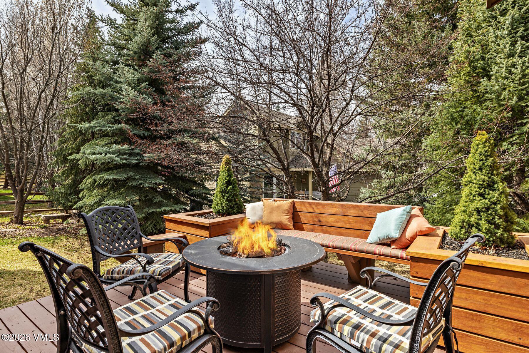 91 Creamery Trail Edwards, CO 81632 - Photo 34 of 44 a backyard of a house with table and chairs