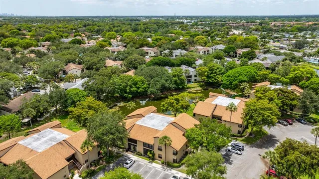 an aerial view of residential houses with outdoor space