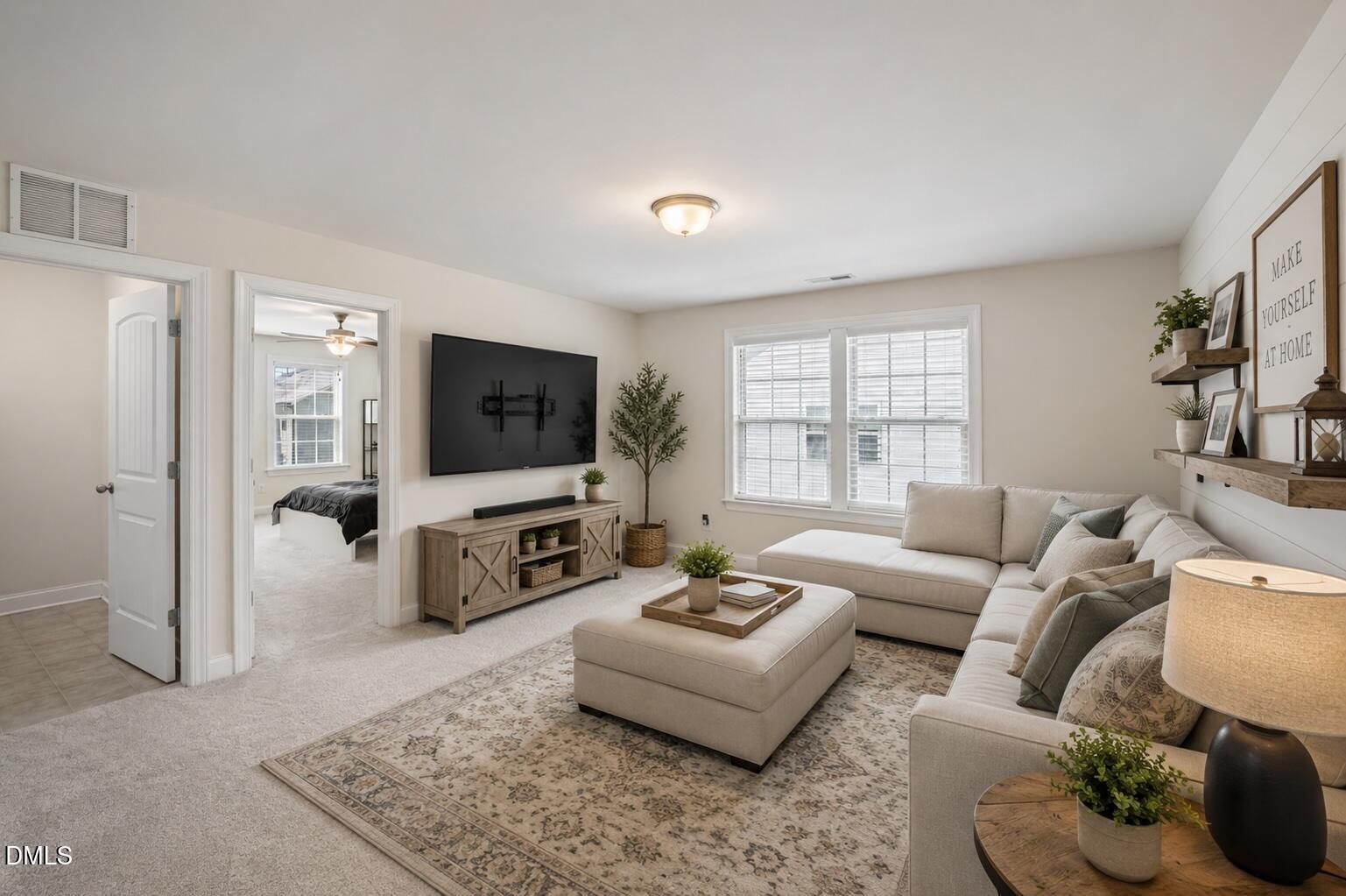 3541 Fairstone Road Wake Forest, NC 27587 - Photo 14 of 39 a living room with furniture flat screen tv and a large window