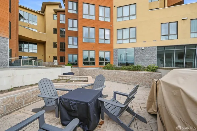 a view of a brick house with a outdoor space