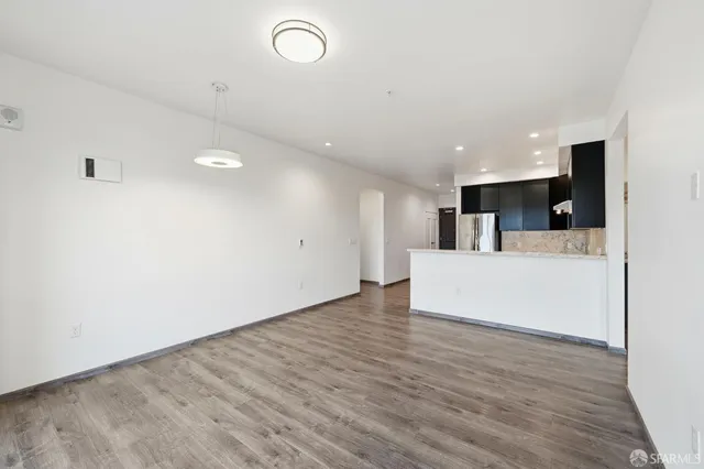 a kitchen with a sink stove and refrigerator