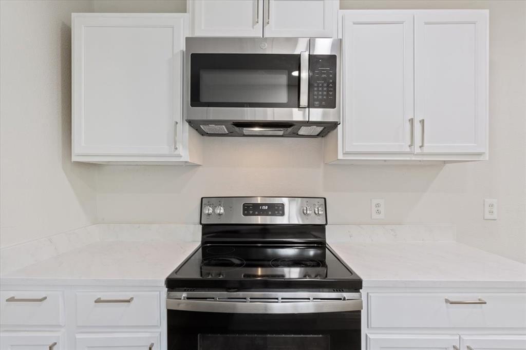 849 Arlington Drive Woodway, TX 76712 - Photo 19 of 33 a stove top oven sitting inside of a kitchen