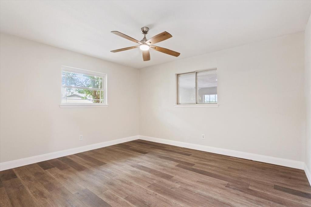 849 Arlington Drive Woodway, TX 76712 - Photo 21 of 33 a view of empty room with wooden floor
