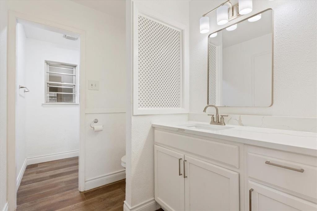 849 Arlington Drive Woodway, TX 76712 - Photo 26 of 33 a bathroom with a sink and a mirror