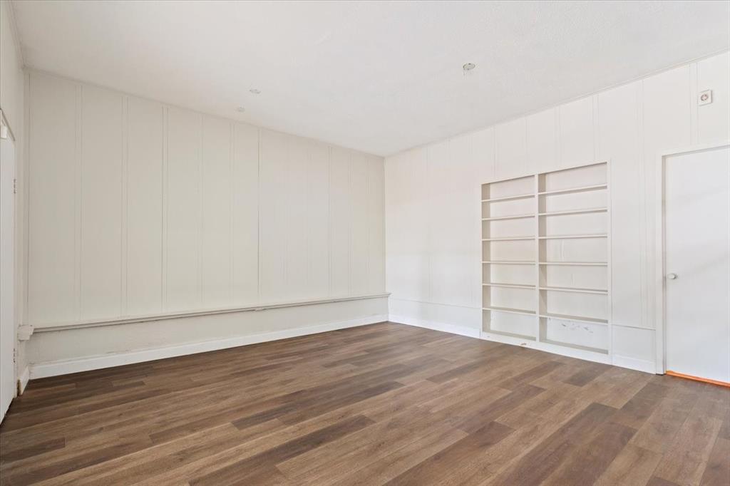 849 Arlington Drive Woodway, TX 76712 - Photo 27 of 33 wooden floor in an empty room