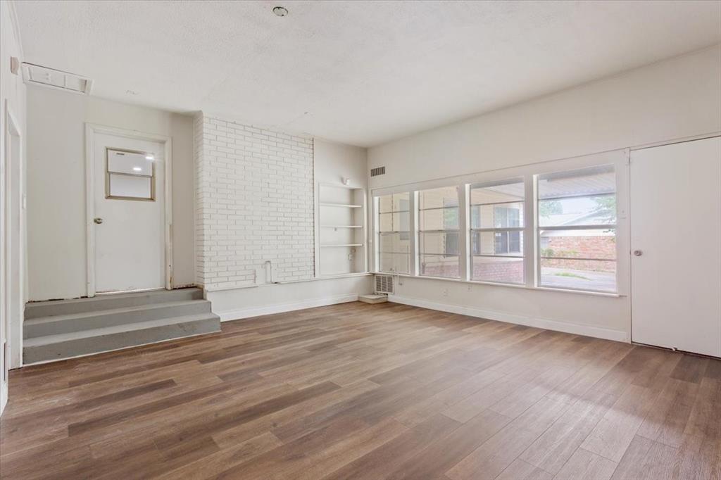 849 Arlington Drive Woodway, TX 76712 - Photo 28 of 33 a view of empty room with wooden floor and fan