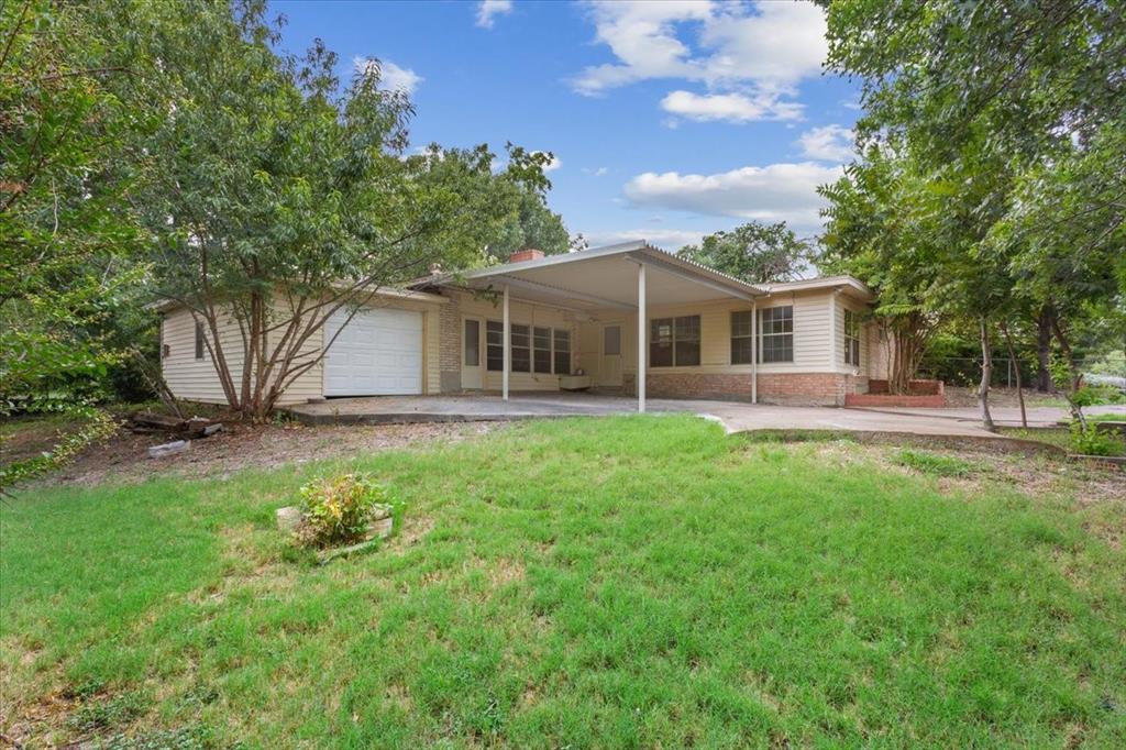 849 Arlington Drive Woodway, TX 76712 - Photo 30 of 33 a view of a house with a backyard porch and sitting area