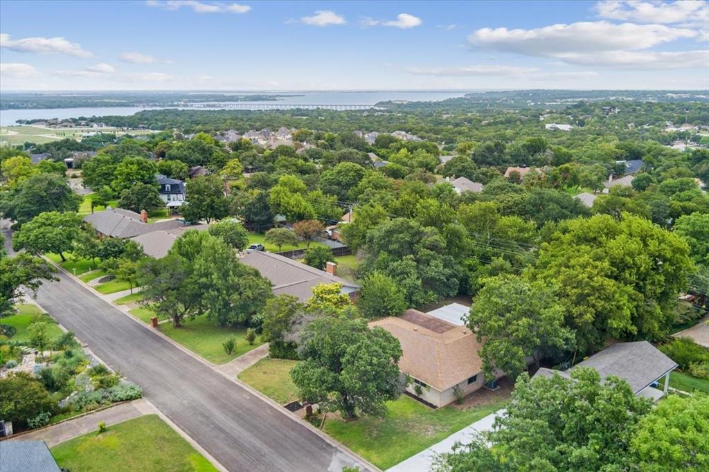 849 Arlington Drive Woodway, TX 76712 - Photo 3 of 33 an aerial view of a house with a yard and outdoor seating