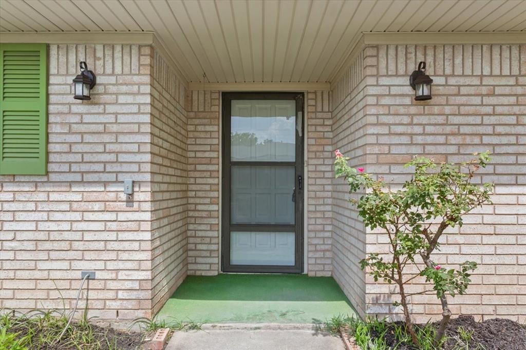 849 Arlington Drive Woodway, TX 76712 - Photo 7 of 33 a view of a door and a window