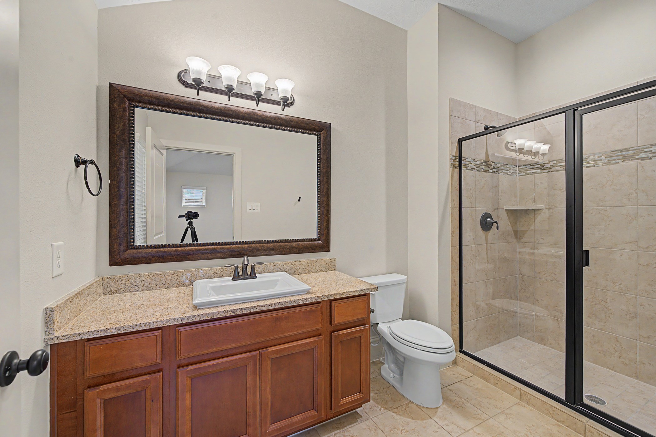 31032 Sunfall Trail Lane Spring, TX 77386 - Photo 24 of 39 a bathroom with a granite countertop sink toilet a mirror a vanity and shower