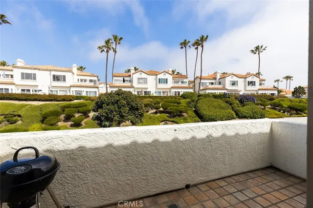 a view of a swimming pool with a yard