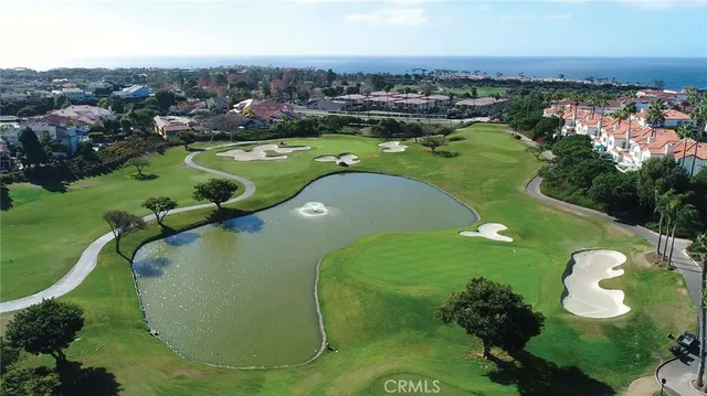 an aerial view of a houses with a swimming pool