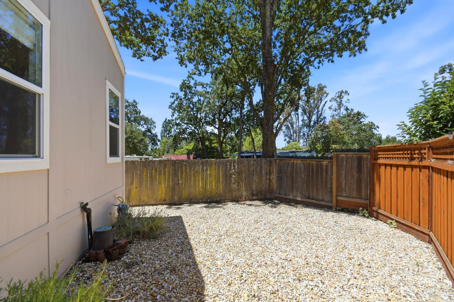 120 Shamrock Circle Santa Rosa, CA 95403 - Photo 38 of 45 a view of backyard with wooden fence and trees