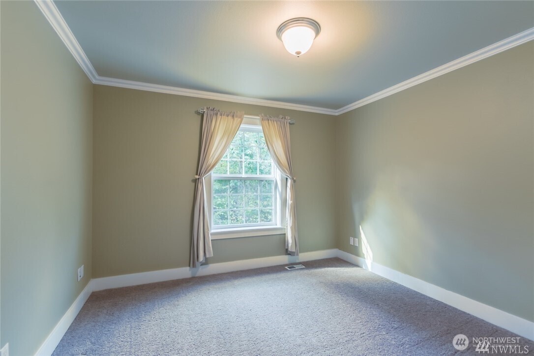 16619 249th Street East Orting, WA 98360 - Photo 12 of 21 an empty room with a window