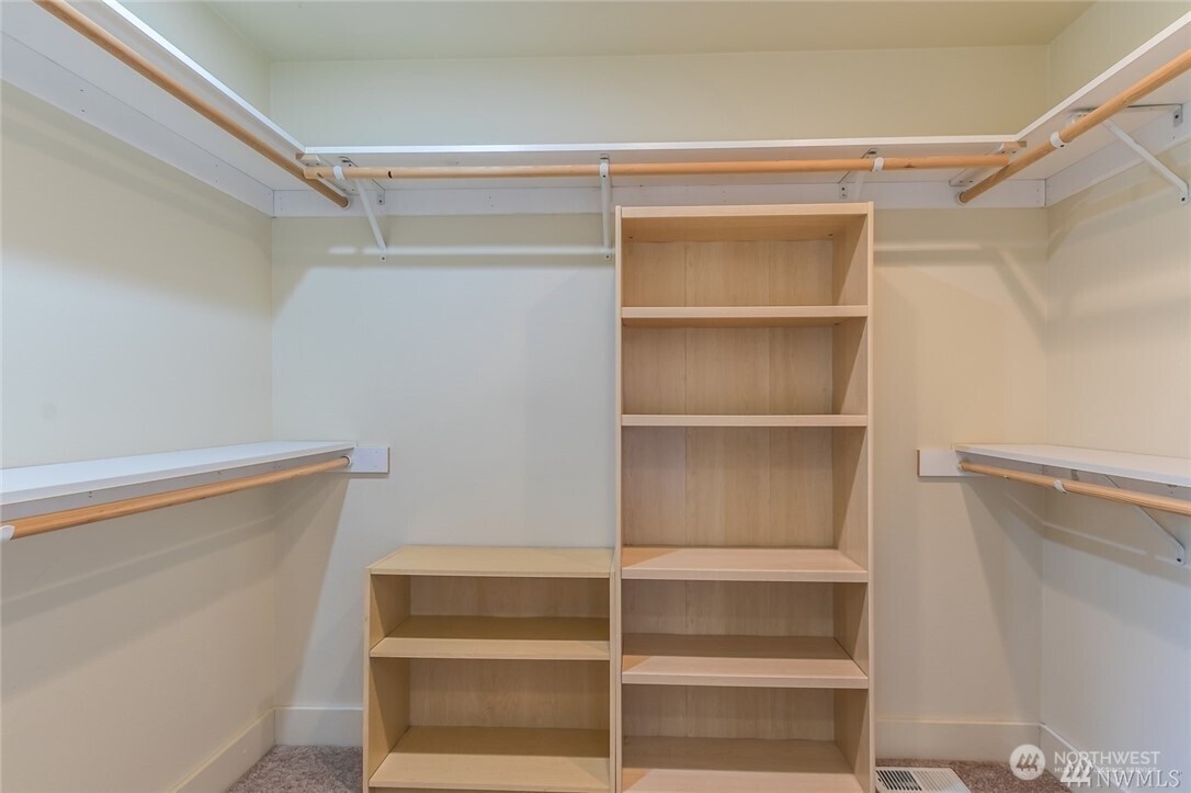 16619 249th Street East Orting, WA 98360 - Photo 18 of 21 a view of walk in closet with empty racks