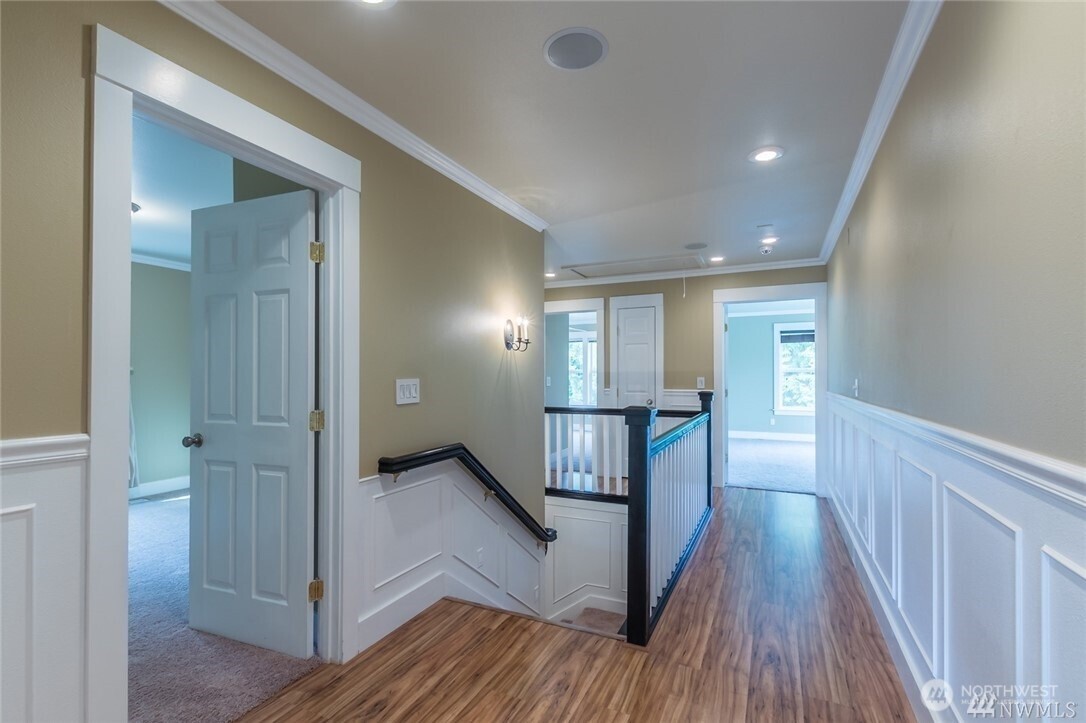 16619 249th Street East Orting, WA 98360 - Photo 8 of 21 a view of hallway with wooden floor and stairs