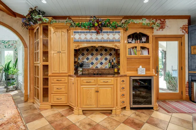 a view of entryway with a fireplace and a garden