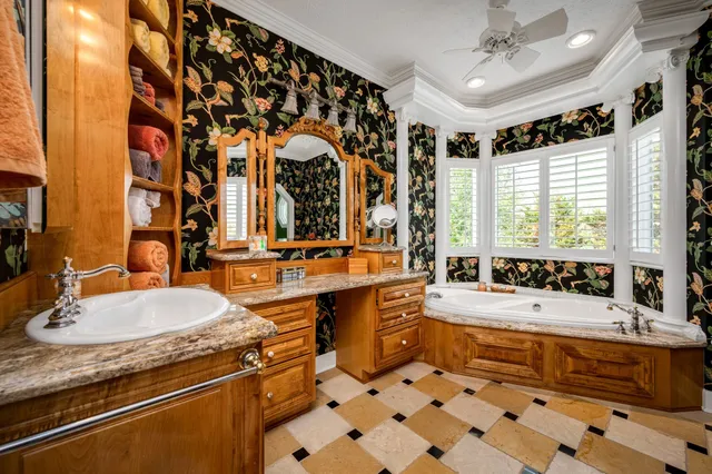 a utility room with cabinets washer and dryer