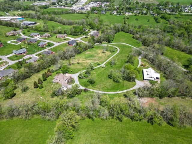 a view of a golf course with a lake view