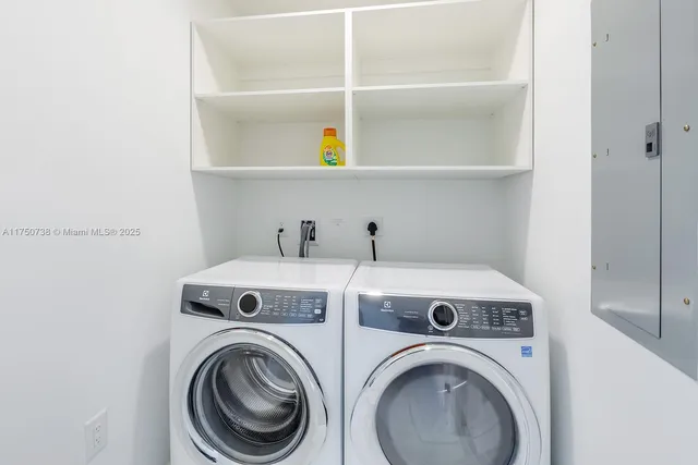 a utility room with dryer and washer