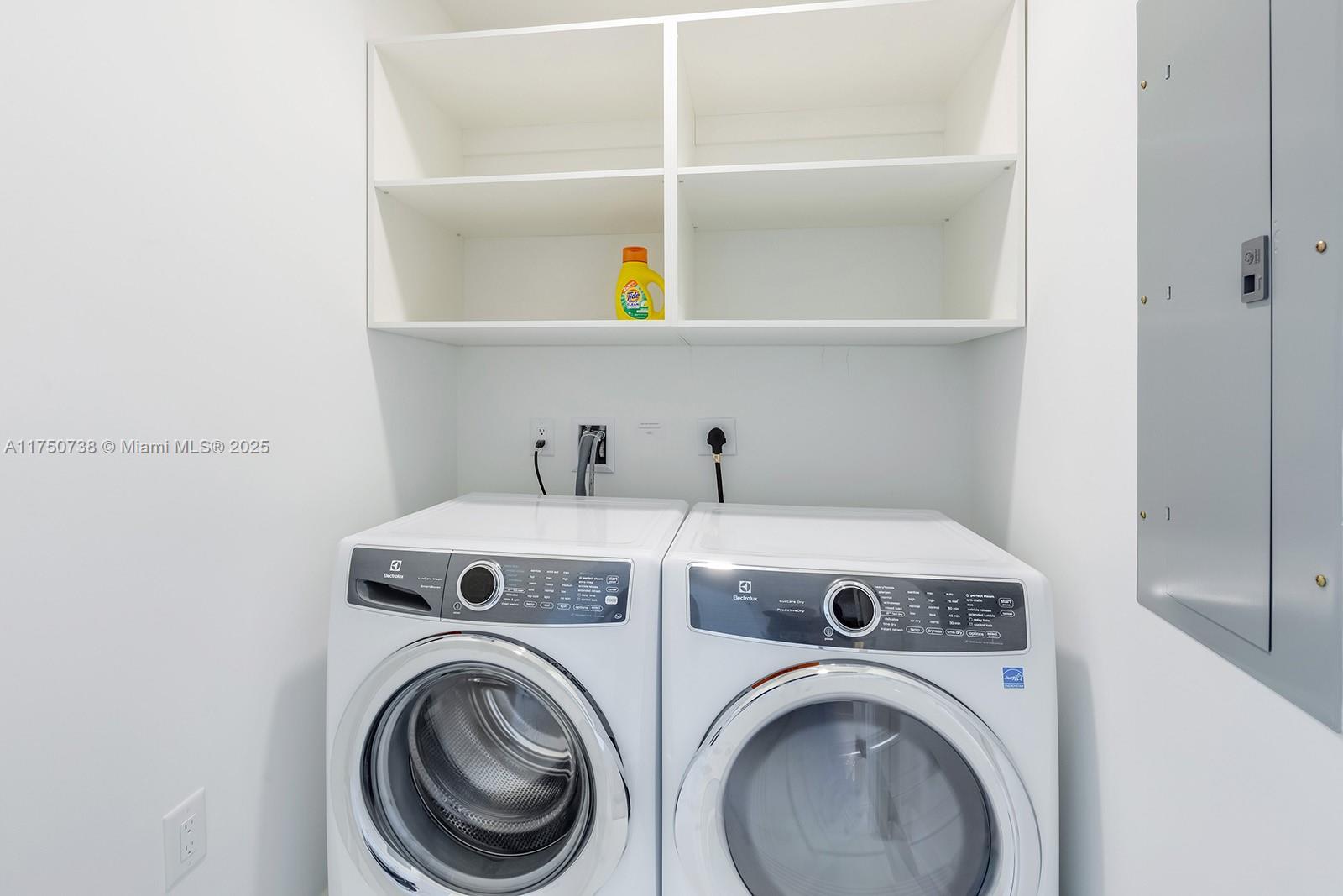 851 Northeast 1st Avenue, Unit 3611 Miami, FL 33132 - Photo 19 of 23 a utility room with dryer and washer