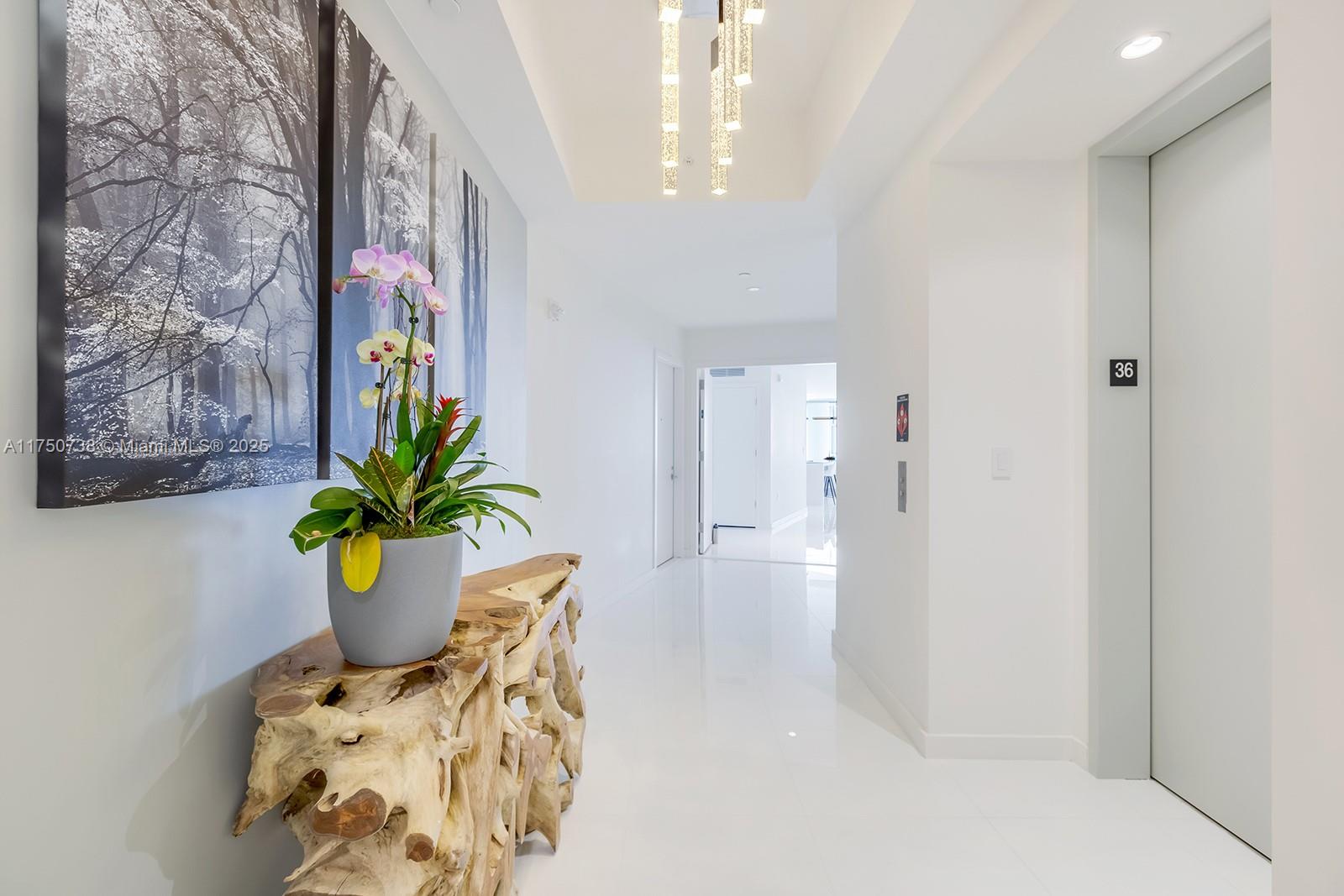 851 Northeast 1st Avenue, Unit 3611 Miami, FL 33132 - Photo 20 of 23 a dining room with furniture and potted plant