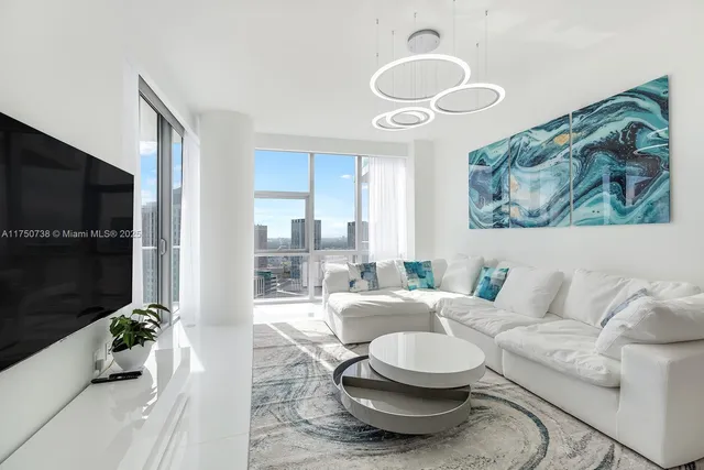 a living room with furniture and a flat screen tv