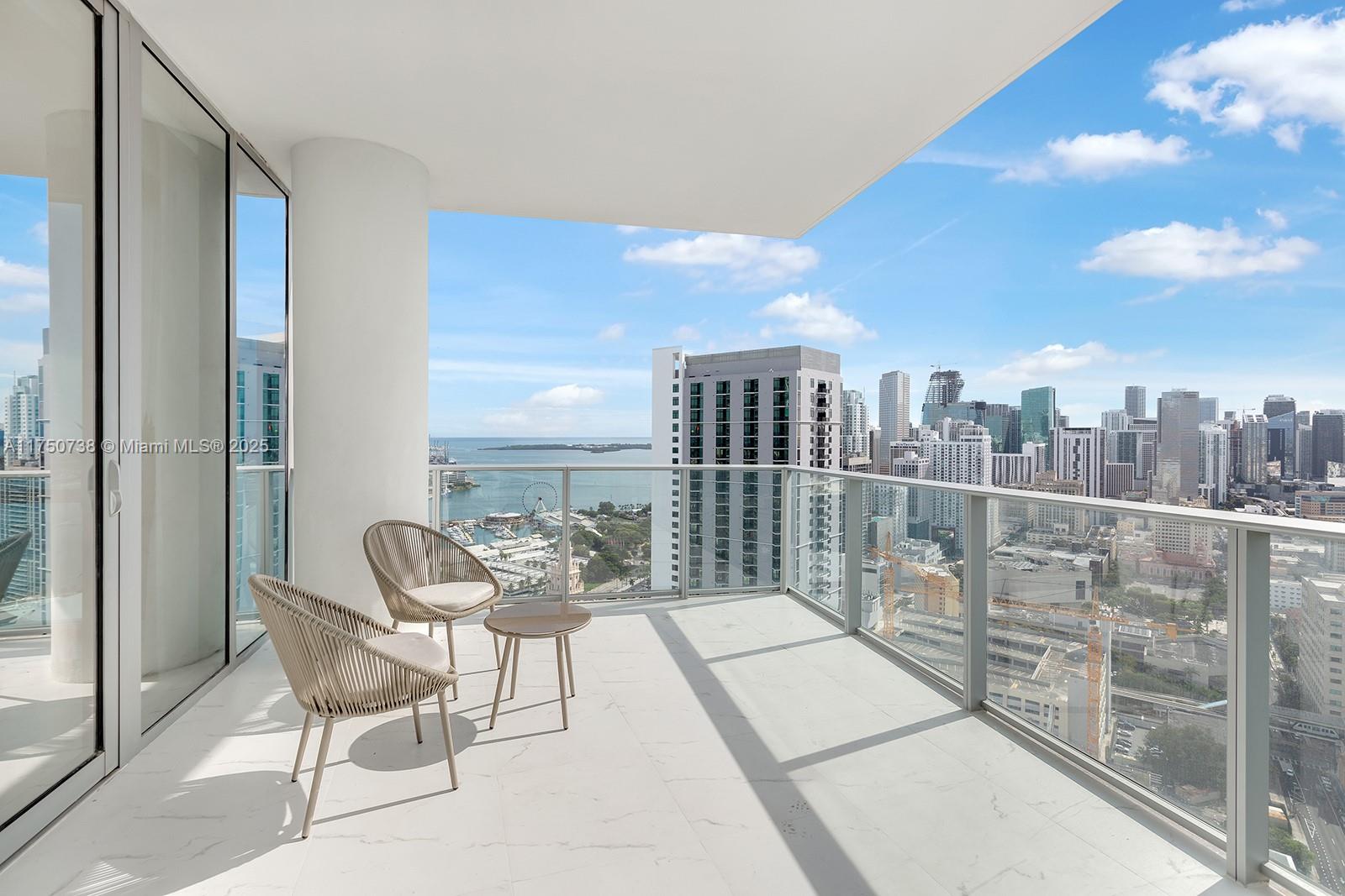 851 Northeast 1st Avenue, Unit 3611 Miami, FL 33132 - Photo 7 of 23 a view of a balcony with furniture