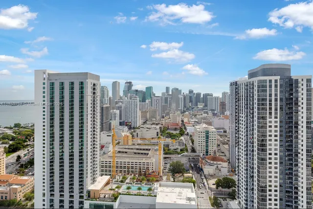 a view of city with tall buildings