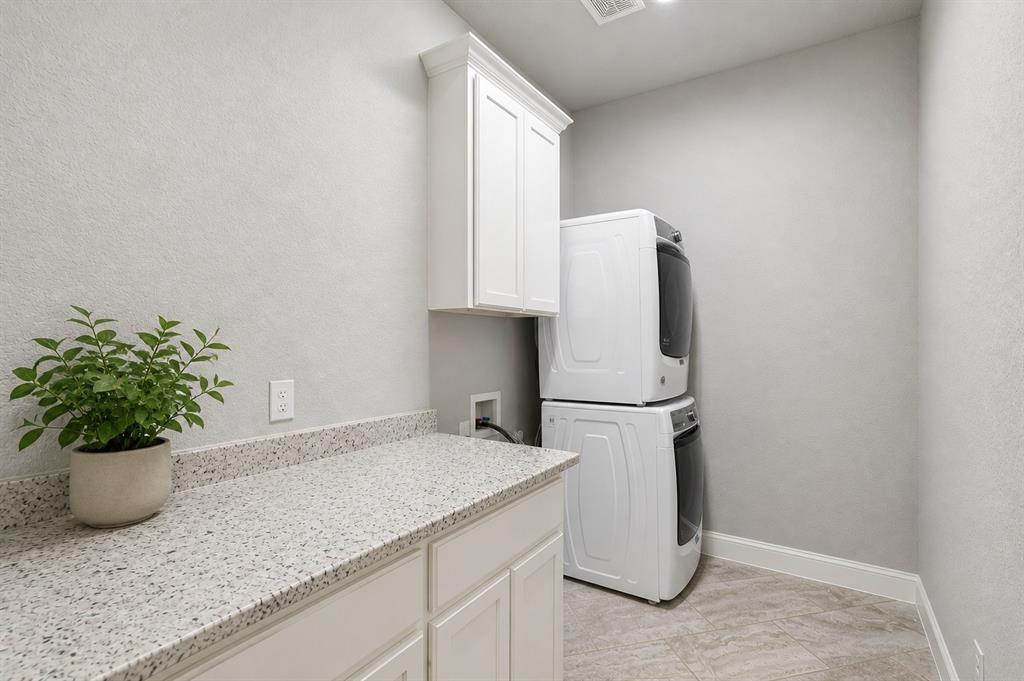 104 Ryder Court Hurst, TX 76053 - Photo 31 of 35 Large Laundry Area With Ample Built-In Storage