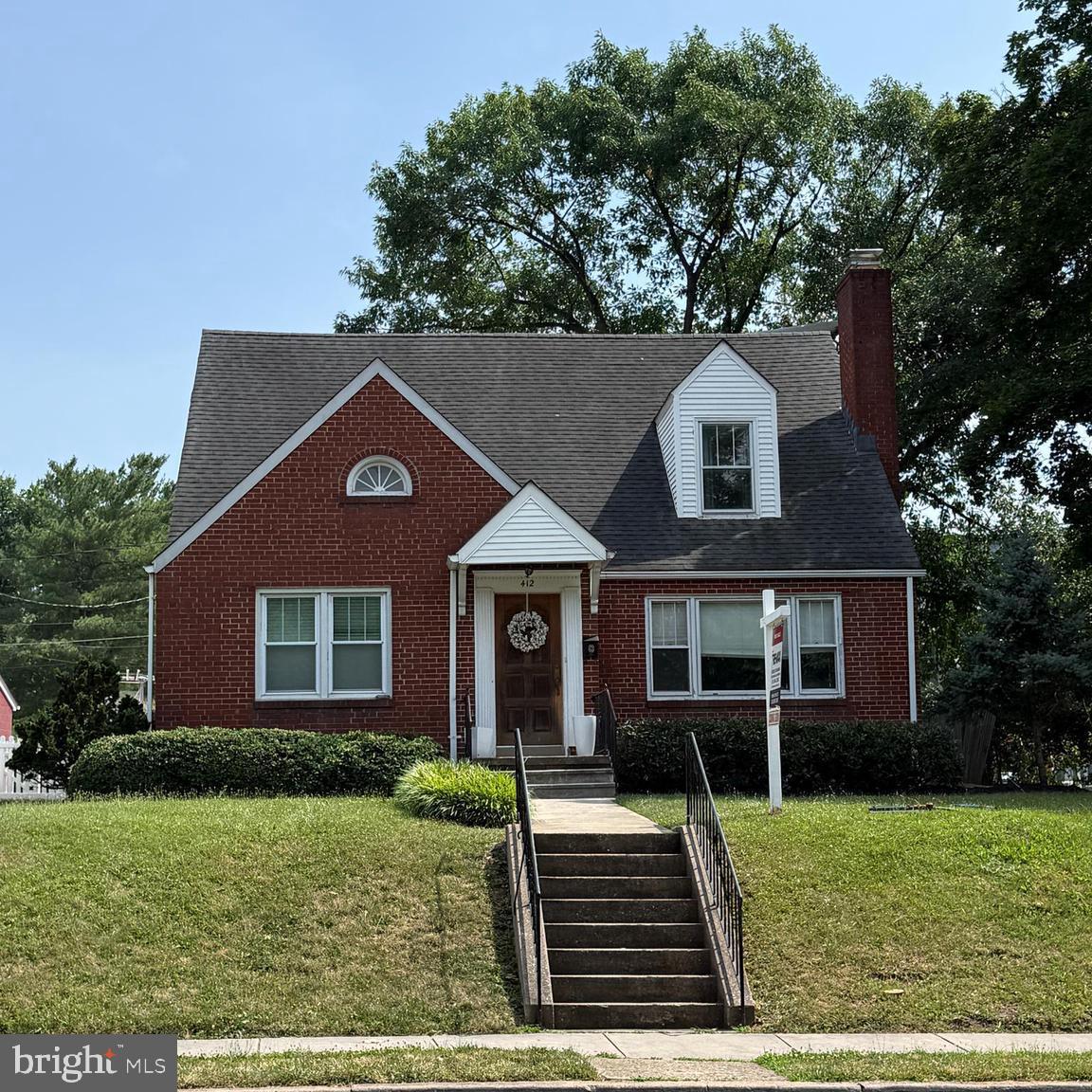 412 Carroll Parkway Frederick, MD 21701 - Photo 2 of 11 front view of a house with a yard