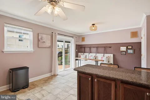 a kitchen with a cabinets a sink and wooden floor