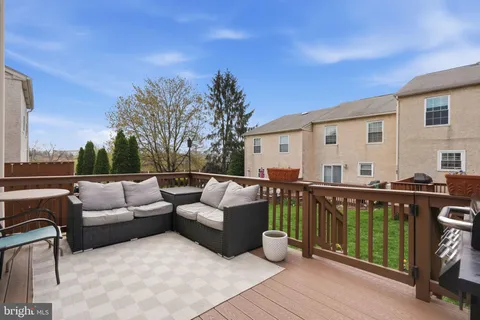 a view of a park and trees in the background