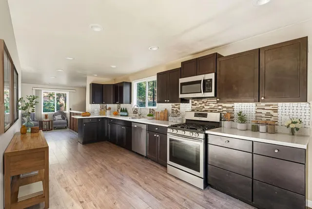 a view of a livingroom with wooden floor