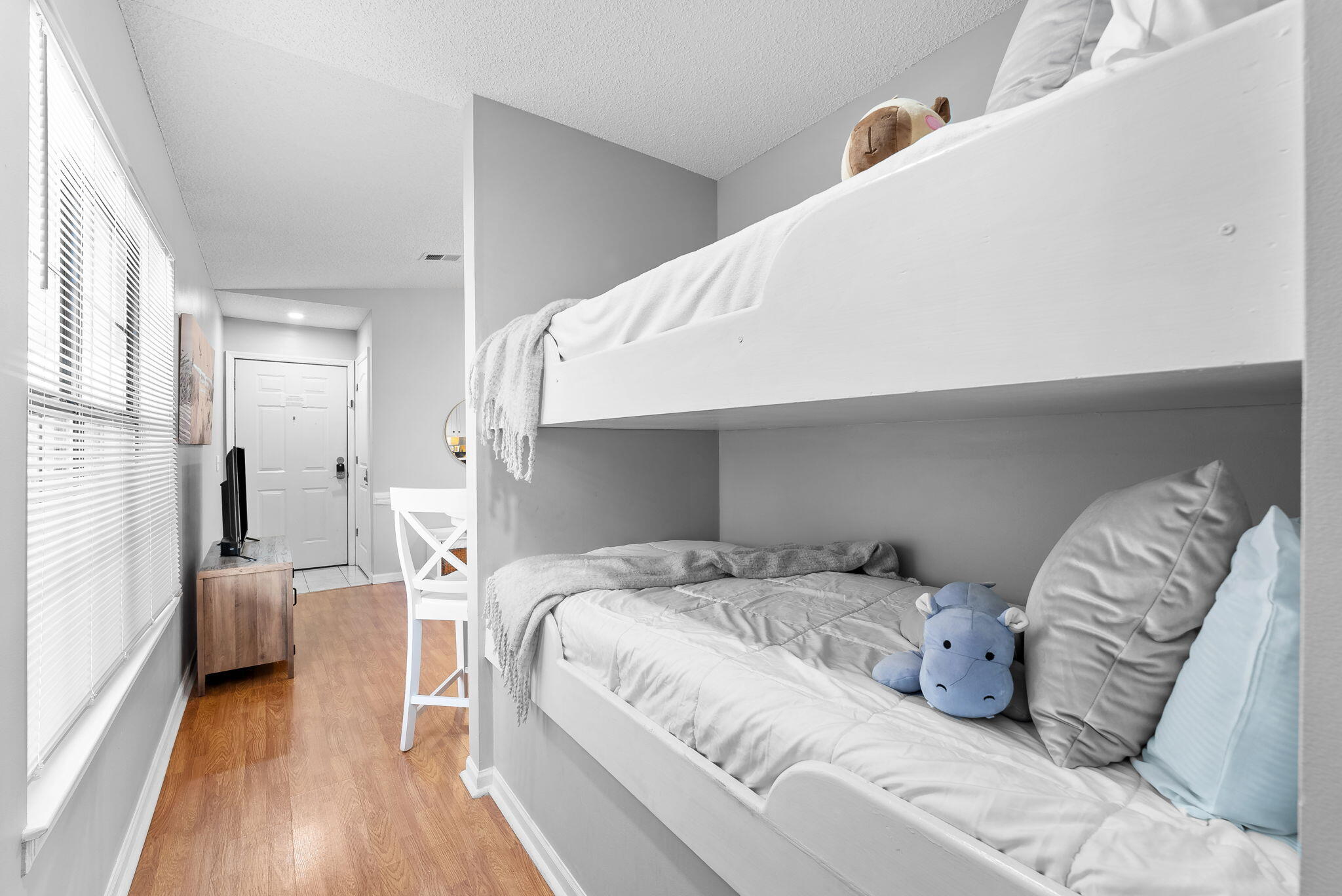 17462 Front Beach Road, Unit 73D Panama City Beach, FL 32413 - Photo 16 of 30 a bedroom with a bed and a couch