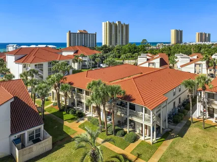 a view of a patio with swimming pool and a yard