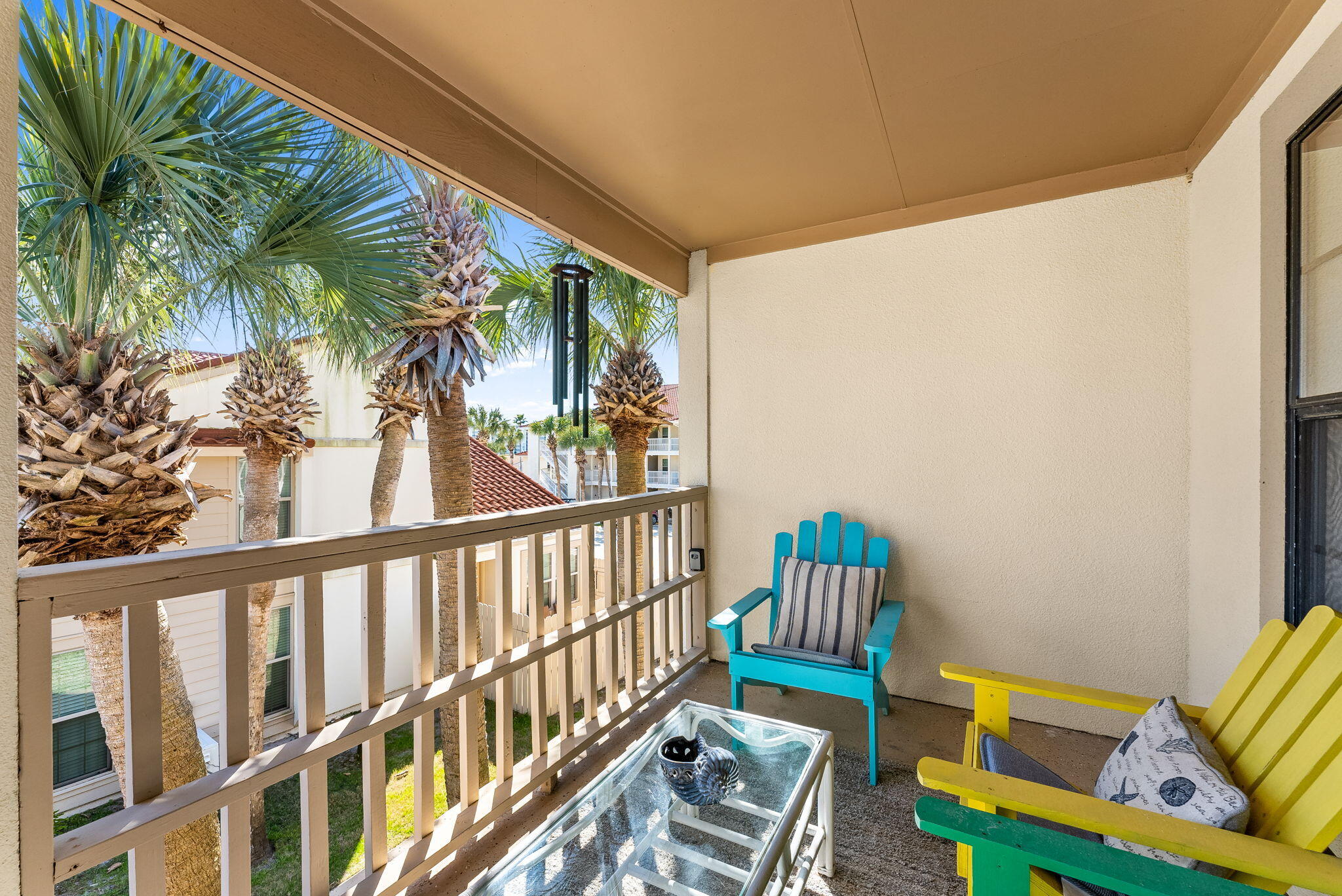 17462 Front Beach Road, Unit 73D Panama City Beach, FL 32413 - Photo 24 of 30 a view of a porch with furniture and a yard