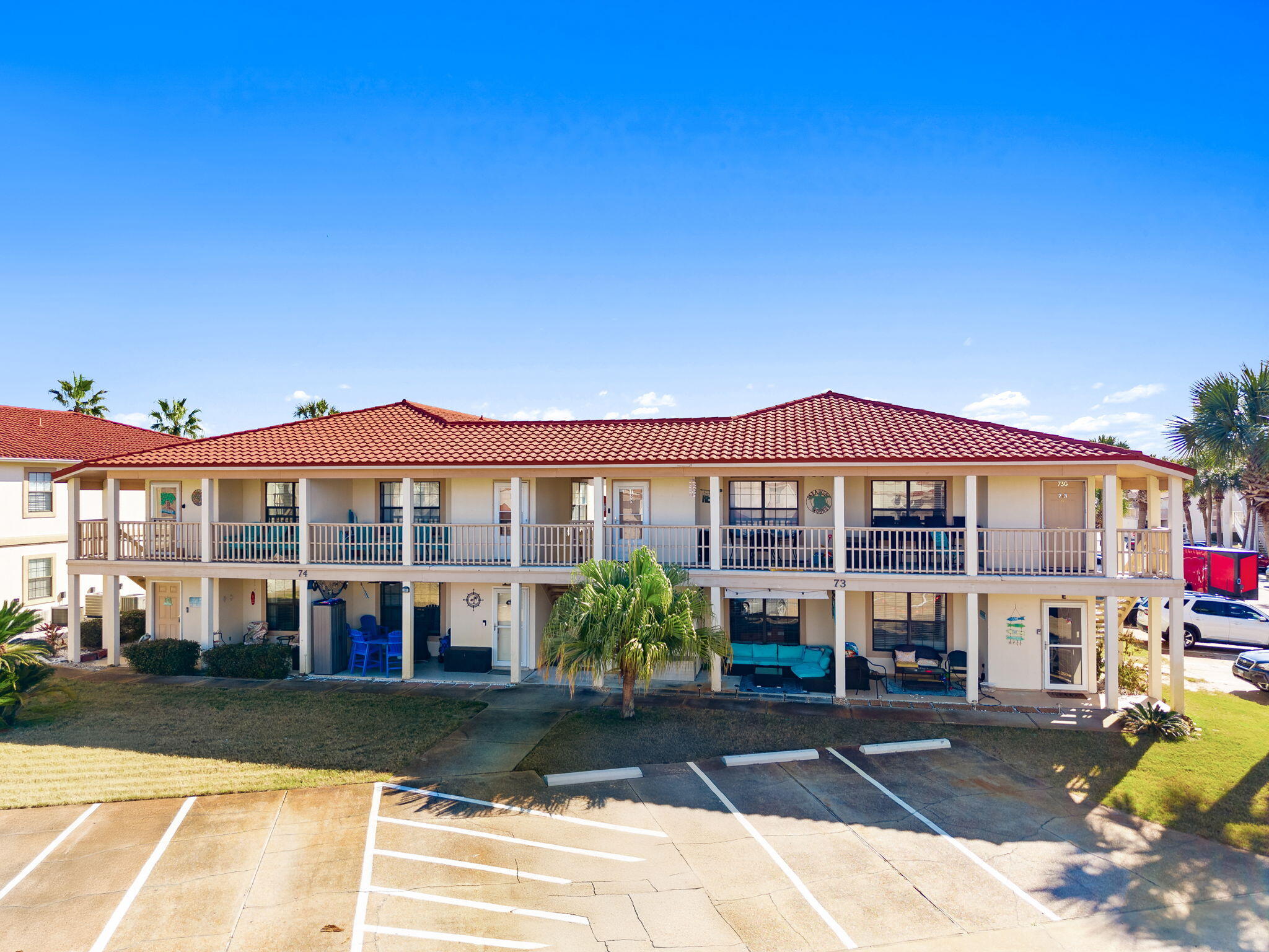 17462 Front Beach Road, Unit 73D Panama City Beach, FL 32413 - Photo 30 of 30 a view of a big house with a yard and plants