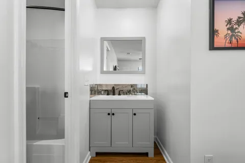 a bathroom with a sink and a mirror