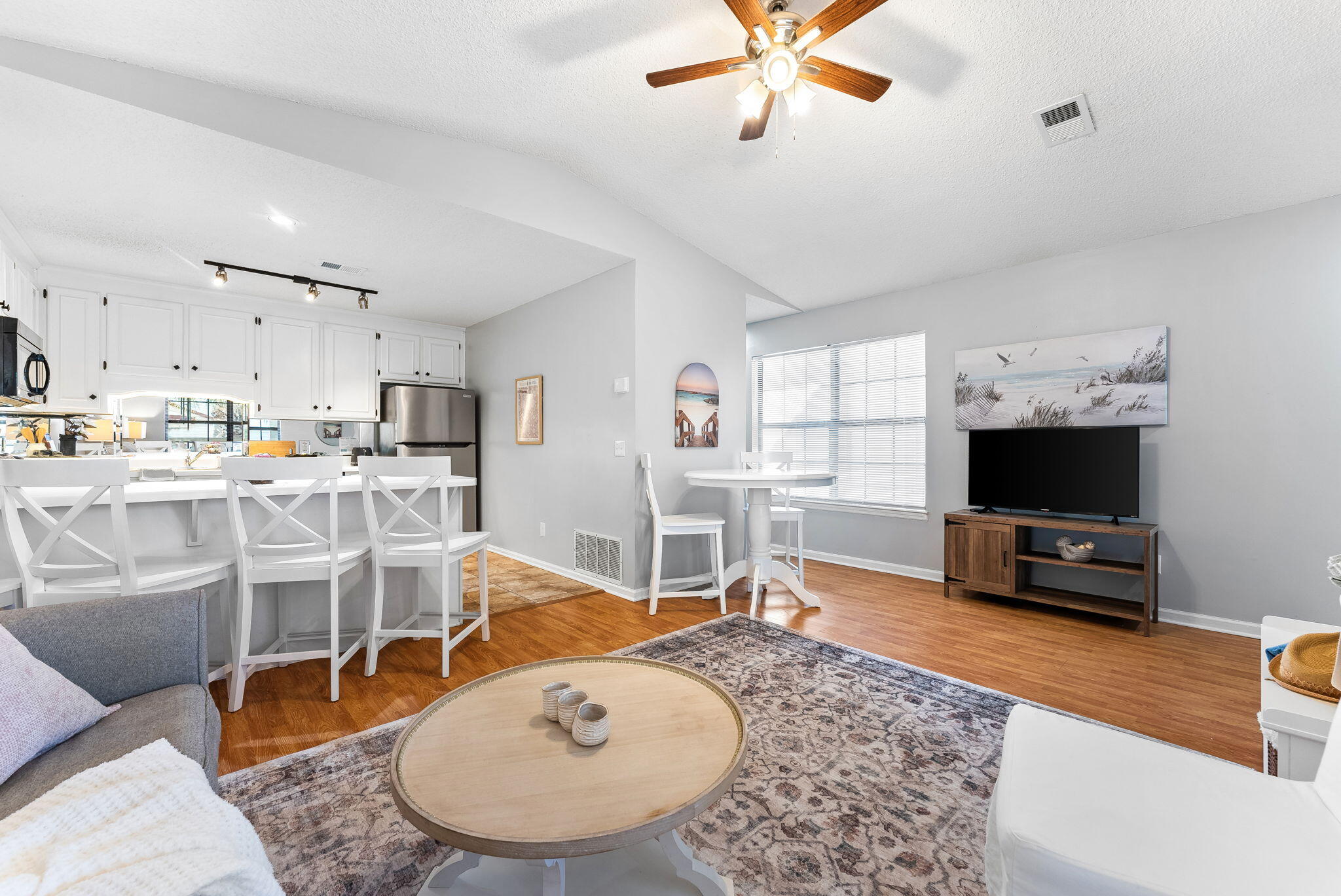 17462 Front Beach Road, Unit 73D Panama City Beach, FL 32413 - Photo 3 of 30 a living room with furniture and a flat screen tv