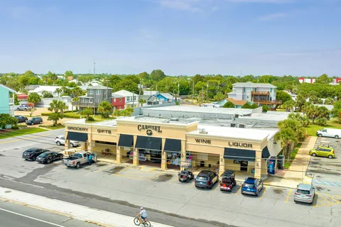 a view of a swimming pool with a table and chairs