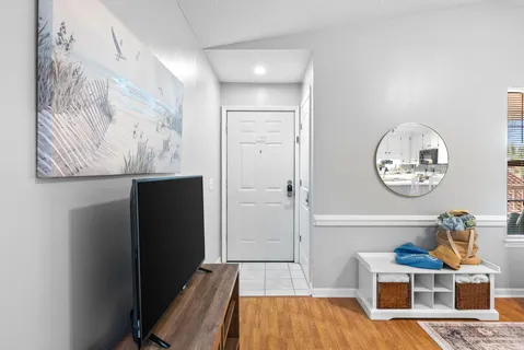 a bathroom with a sink vanity and mirror