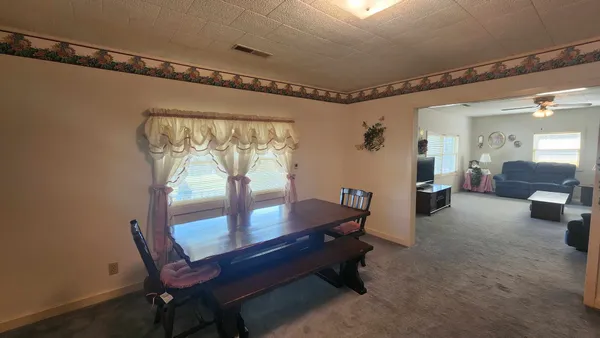 a kitchen with a sink cabinets and window