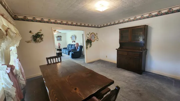 a view of a room with furniture window and wooden floor